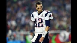 GLENDALE, AZ - FEBRUARY 01: Tom Brady #12 of the New England Patriots walks off the field while playing the Seattle Seahawks  in the third quarter during Super Bowl XLIX at University of Phoenix Stadium on February 1, 2015 in Glendale, Arizona.  (Photo by Elsa/Getty Images)