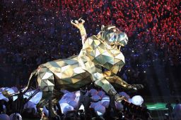 Katy Perry took a literal approach to 'Roar' as her Super Bowl halftime show began.