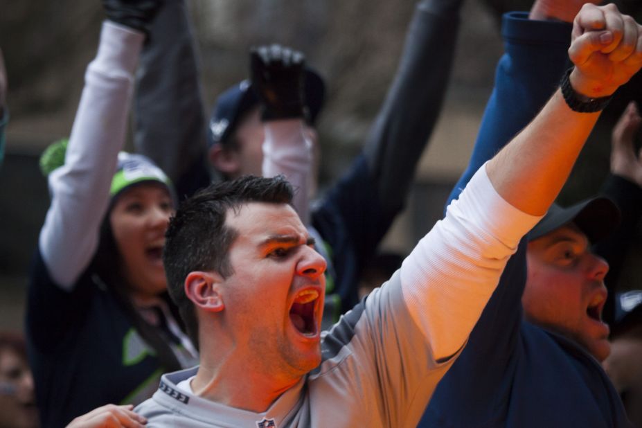Seahawks fans cheer as they watch the game on television in Seattle.