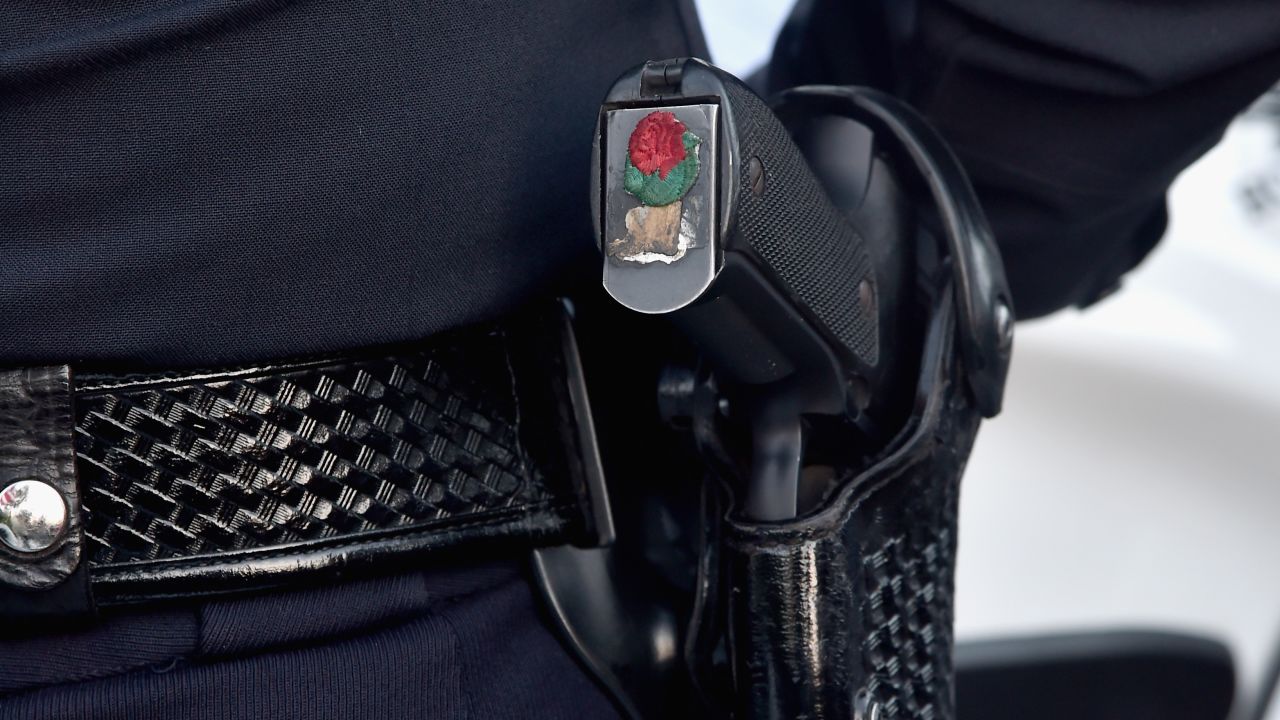 PASADENA, CA - JANUARY 01: A city of Pasadena police officer (gun detail) participates in the 126th Annual Tournament of Roses Parade presented by Honda on January 1, 2015 in Pasadena, California. (Photo by Alberto E. Rodriguez/Getty Images)