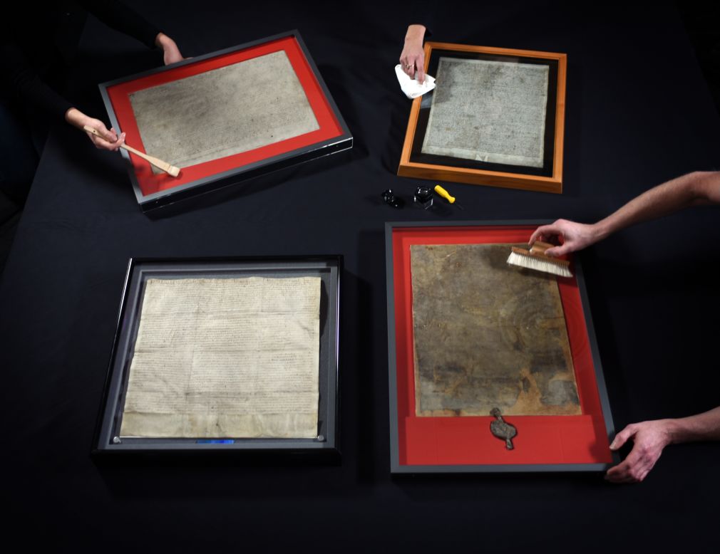 The four surviving Magna Carta manuscripts have gone on display at the British Library in London. More than 43,000 people from around the world applied for tickets to see them together; just 1,215 will get in to the historic three-day exhibition.