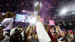 Members of the New England Patriots celebrate with the Vince Lombardi Trophy after defeating the Seattle Seahawks 28-24 in Super Bowl XLIX at University of Phoenix Stadium in Glendale, Arizona, on Sunday, February 1.