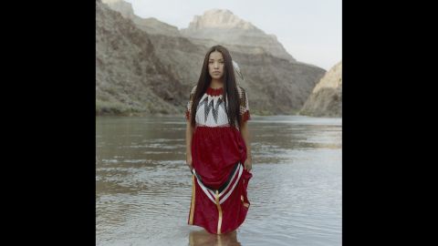 Sage Honda, a 22-year-old from Peach Springs, Arizona, wears a handmade dress at the Grand Canyon, a sacred site of the Hualapai people. Since appearing in Miss Native American USA, she has been encouraging Native youth to travel off the reservation to explore more opportunities. "I want to be a role model to show my community and youth that it is possible to come off our land and do big things," she said in the "Red Road" photo series.