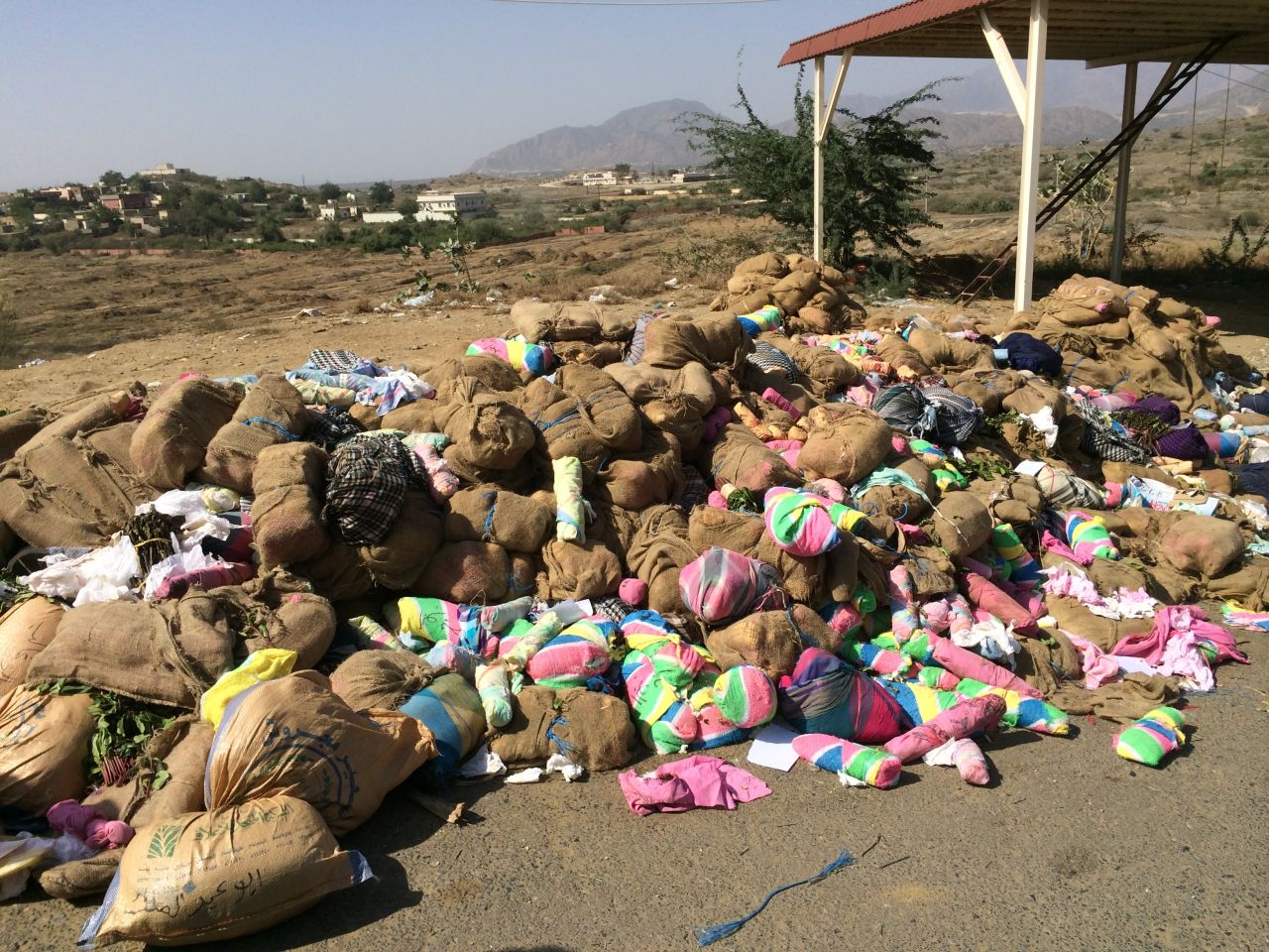 Several tons of qat lie piled up outside a guard post -- the haul of the past week, or so we were told.