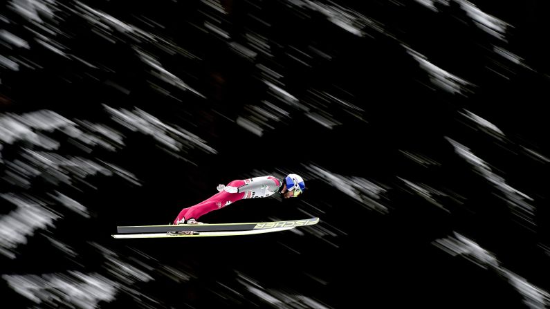 Italy's Alessandro Pittin competes in the ski jumping portion of a Nordic combined event Sunday, February 1, in Val di Fiemme, Italy.