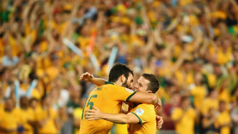 Australian soccer players Mile Jedinak, left, and Matt McKay embrace each other Saturday, January 31, after the "Socceroos" defeated South Korea to win the Asian Cup in Sydney. It was the first Asian Cup title in the country's history.