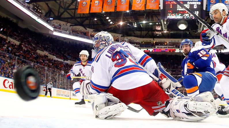 A puck slips past New York Rangers goaltender Henrik Lundqvist during an NHL game played Tuesday, January 27, against the New York Islanders. The Islanders won the game 4-1 and have now beaten their rivals all three times they have played this season. 