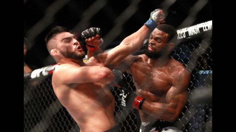 Tyron Woodley, right, punches Kelvin Gastelum during UFC 183, which was held Saturday, January 31, in Las Vegas. Woodley won the fight by split decision.