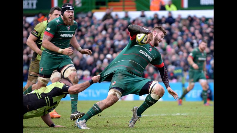 Laurence Pearce, a rugby player with the Leicester Tigers, has his shirt pulled by Gareth Denman of the Northampton Saints during an LV Cup match played Saturday, January 31, in Leicester, England. The Tigers won the match 17-8.