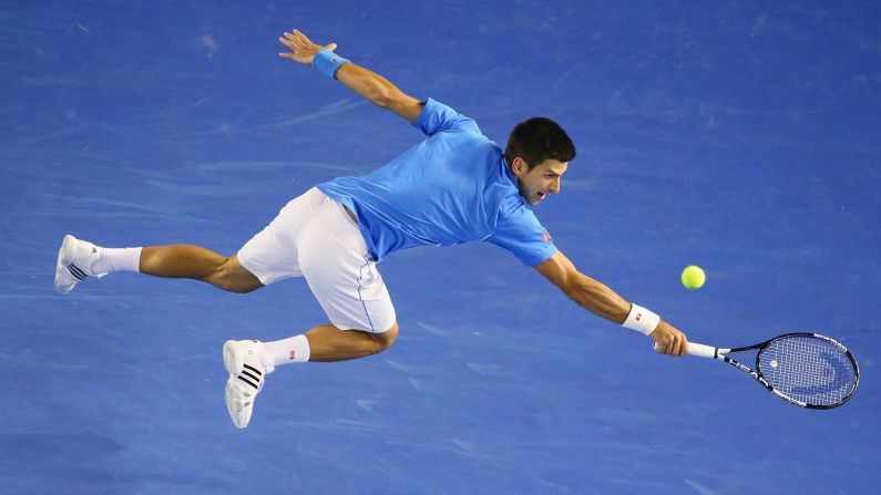 Novak Djokovic stretches for a backhand during a quarterfinal match at the Australian Open on Wednesday, January 28. Djokovic would eventually win the tournament, his fifth Australian Open title and his fourth in the past five years. Djokovic has now won eight Grand Slams.