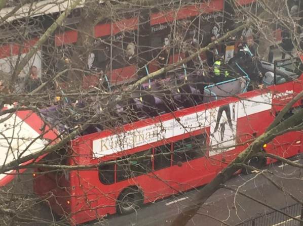 Firemen used a winch to remove the final section of the bus roof.