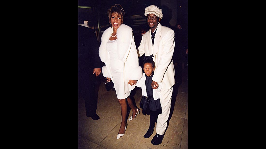 Bobbi Kristina was photographed with her famous parents often in the early years of their marriage. Here she is with them in the mid-'90s.