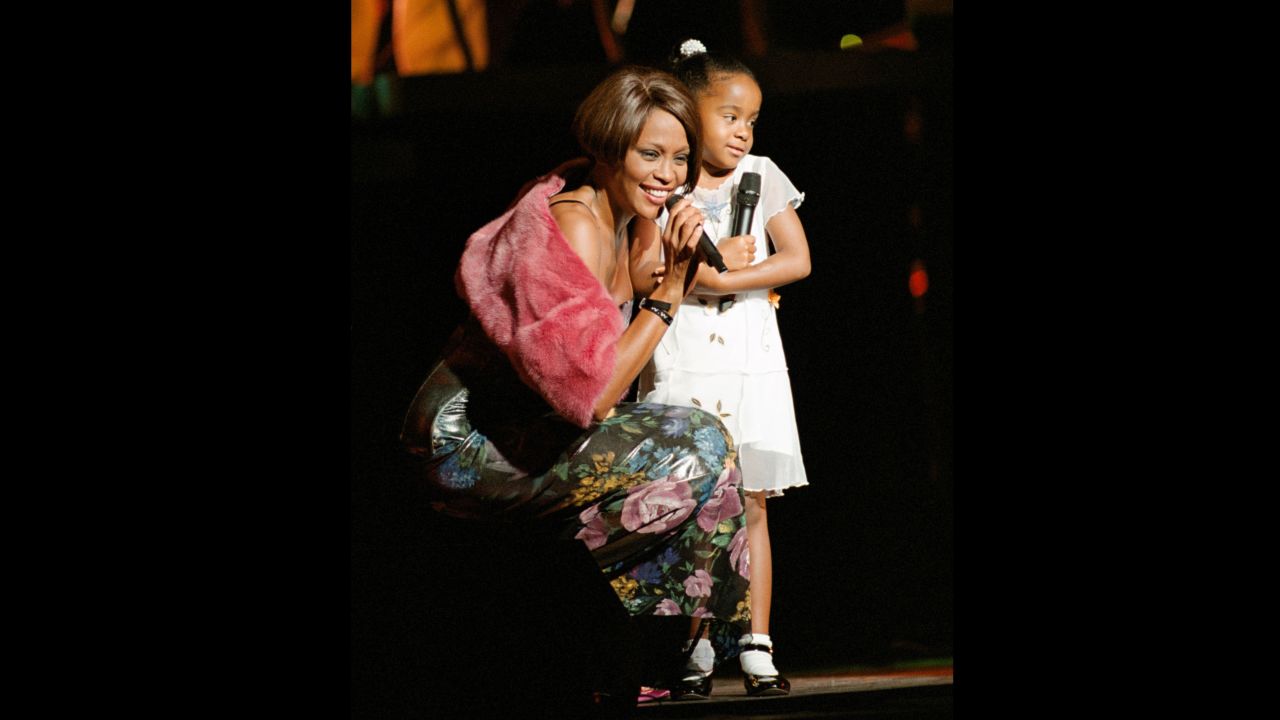 Bobbi Kristina, 6, appears with her mom on stage at a 1999 concert in New York. 