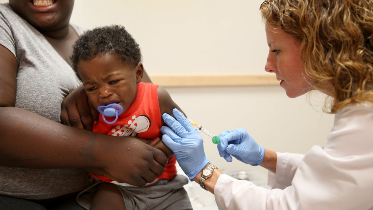 MIAMI, FL - JUNE 02: India Ampah holds her son, Keon Lockhart, 12 months old, as pediatrician Amanda Porro M.D. administers a measles vaccination during a visit to the Miami Children's Hospital on June 02, 2014 in Miami, Florida. The Centers for Disease Control and Prevention last week announced that in the United States they are seeing the most measles cases in 20 years as they warned clinicians, parents and others to watch for and get vaccinated against the potentially deadly virus. (Photo by Joe Raedle/Getty Images)