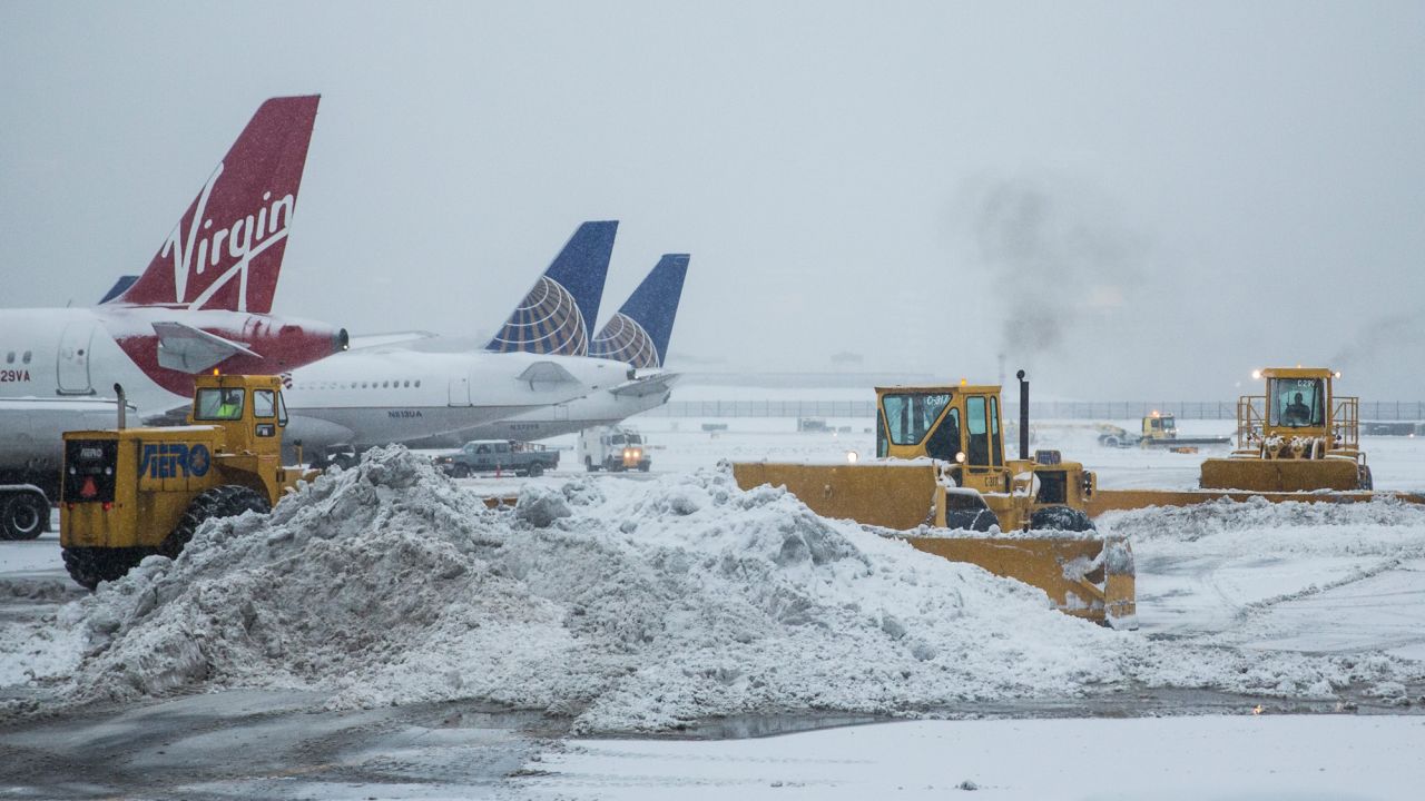 Caption:NEW YORK, NY - FEBRUARY 02: The tarmac of La Guardia Airport is cleared during a winter storm on February 2, 2015 in the Queens borough of New York City. The snowstorm, which is effecting an area stretching from New York to Chicago, is disrupting travelers both on the road and in the air. (Photo by Andrew Burton/Getty Images)
