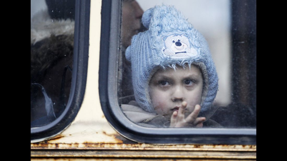 A child waits on a bus to leave Debaltseve on Tuesday, February 3, after increased fighting in the region. 