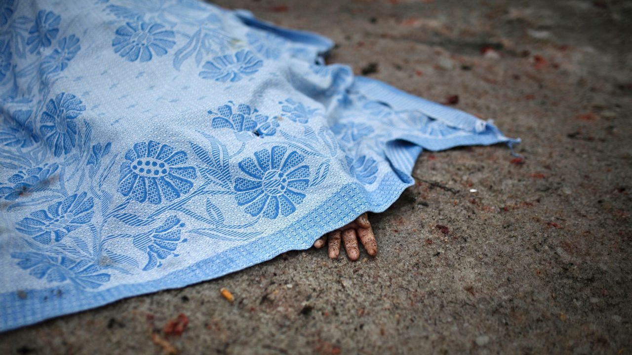 The body of a civilian killed during shelling lies on the ground in Donetsk on Friday, January 30.