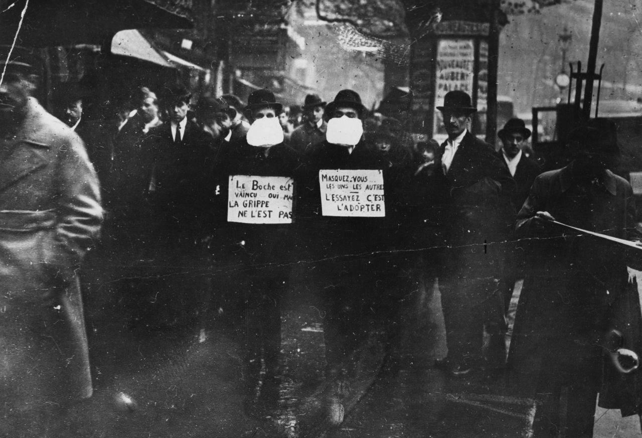 The greatest pandemic to date was Spanish flu, which spread in 1918 and is estimated to have infected a third of the world's population at the time and caused approximately 50 million deaths. Two men wearing and advocating the use of flu masks in Paris during the Spanish flu epidemic in March 1919.
