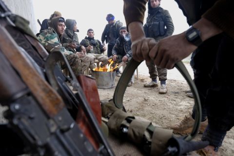 Members of the YPG prepare their ammunition on January 31.