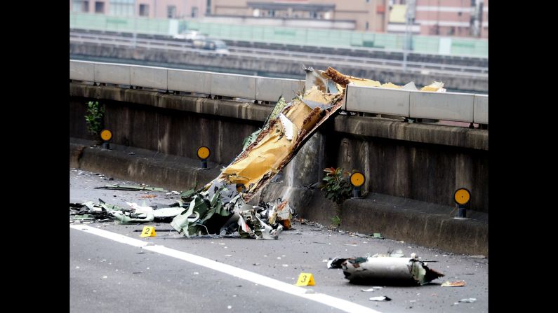 Debris from the plane sits on the bridge in Taipei on February 4.
