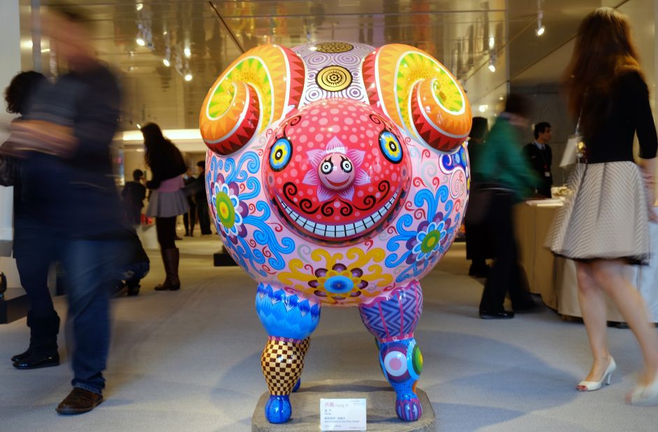 Tourists in Taipei, Taiwan, walk past a statue made by Taiwanese sculptor Hung Yi to celebrate the Year of the Sheep on Friday, January 23. 