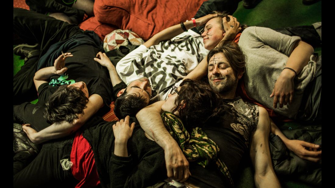 Residents lie together in the London squat called "Borough High Street." The communal squatting lifestyle often creates strong bonds and a family feeling among the residents. 