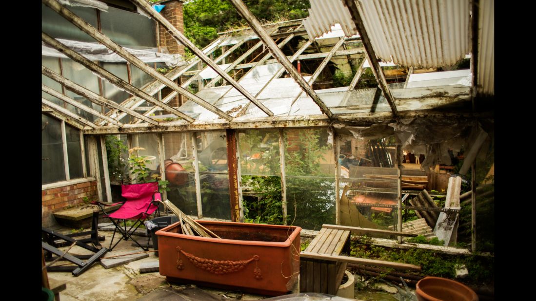 An abandoned greenhouse sits in a squat called "Garden Centre."