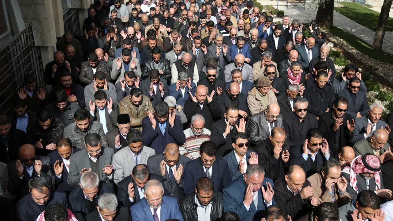 Muslims pray in the streets of Amman on February 4.    