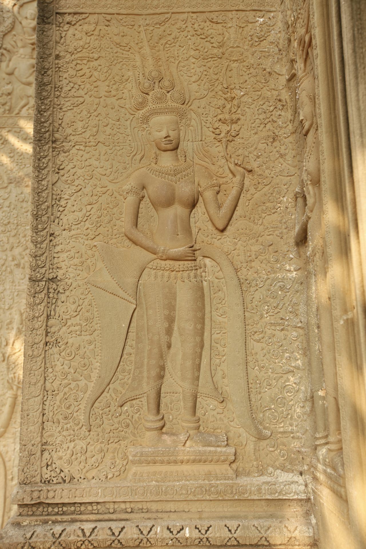 "The Devata [goddesses] at Angkor Wat do all seem to be quite distinct from one another, leading several people to speculate they might be portraits of real people," says Carter. Case in point, this one-of-a-kind smiling lady, found near an entrance gate at Angkor Wat. You won't find another Apsara or Devata carving among the thousands at Angkor that shows her teeth says Cambodian guide Tong Hann. 