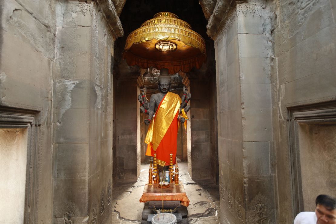 Many tourists walk right by this Vishnu statue near the west entrance of Angkor Wat without realizing its significance, says Alison Carter. 