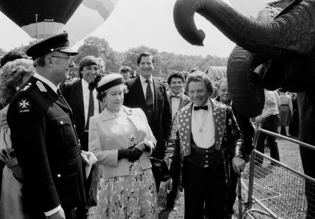 The Queen reacts to an elephant as she tours a charity event in London's Hyde Park in June 1987.