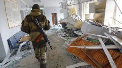 A pro-Russian rebel walks in the hospital of Donetsk's Tekstilshik district after it was hit by a shelling, on Febuary 4, 2015. At least 12 people were killed in fighting between soldiers and pro-Russian separatists in east Ukraine, including four civilians who died when a hospital was hit in rebel stronghold Donetsk today.