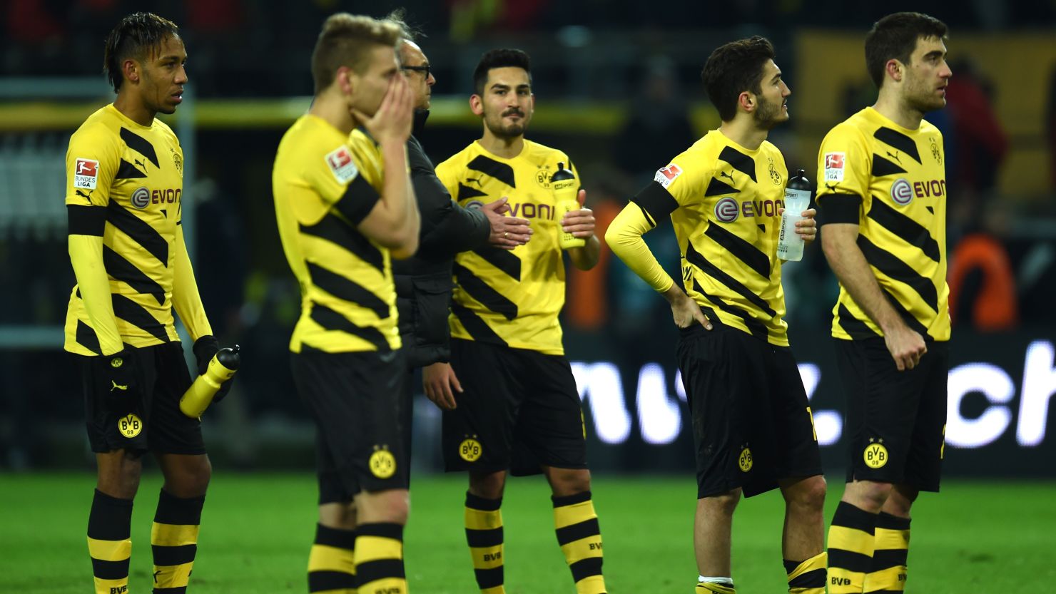 Borussia Dortmund players react to their 1-0 defeat against Augsburg Wednesday.