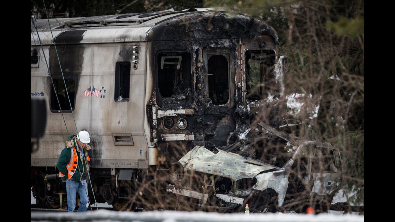 Emergency personnel in Valhalla, New York, stand near the site of a collision that occurred between an SUV and a Metro-North commuter train on Tuesday, February 3. <a href="http://www.cnn.com/2015/02/03/us/new-york-train-collision/index.html" target="_blank">At least seven people died</a> and more than a dozen were injured, a rail official said.