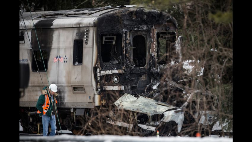 VALHALLA, NY - FEBRUARY 04:  Officials inspect a Metro-North train crash with a sport utility vehicle that occured last night on February 4, 2015 in Valhalla, New York. The crash started a fire in the train cars that killed six people, including the driver of the vehicle. 