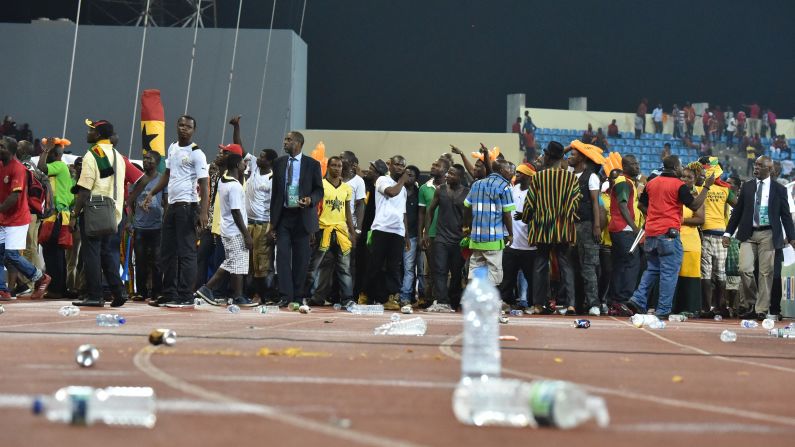 Ghana supporters try to get out of the stadium. Ghana won 3-0, but the game will be remembered for the crowd trouble.