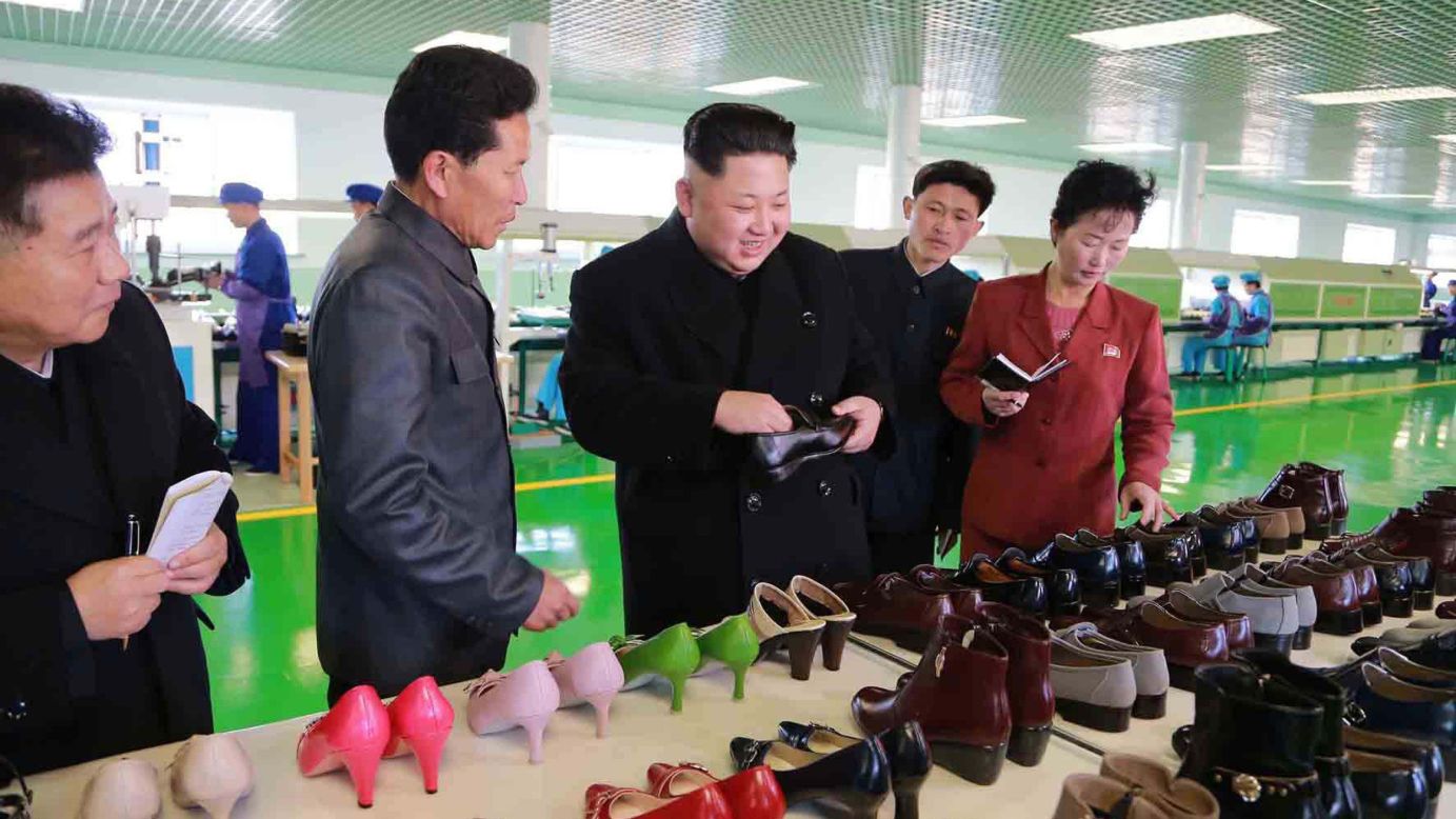 North Korean leader Kim Jong Un, third from left, visits the Wonsan Shoes Factory in Pyongyang, North Korea, in this undated photo released by North Korea's state-run news agency on Saturday, January 31.