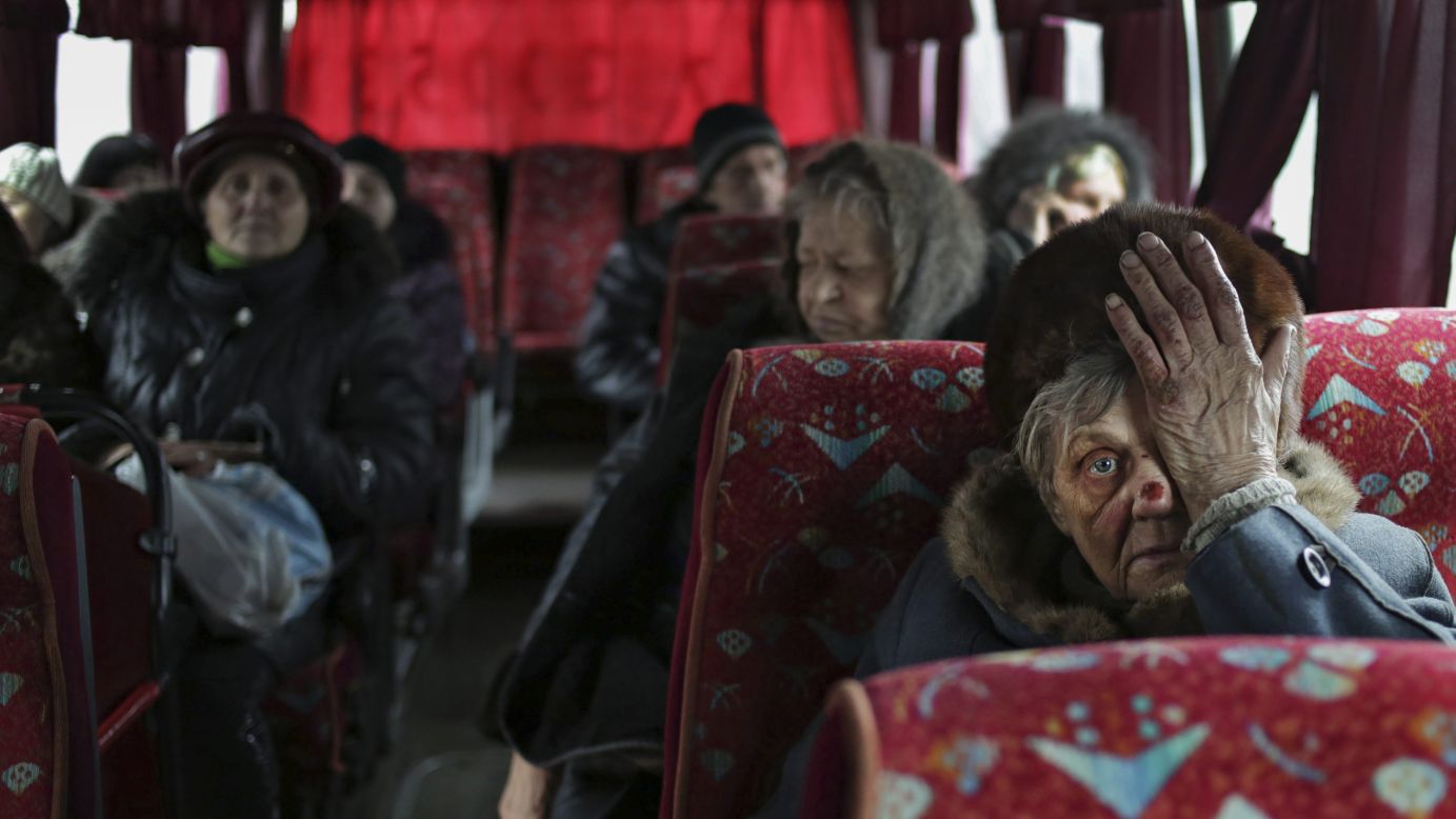 People sit on a bus as they wait to leave the town of Debaltseve, Ukraine, on Tuesday, February 3. <a href="http://www.cnn.com/2015/01/23/world/gallery/ukraine-crisis-2015/index.html" target="_blank">Fighting between Ukrainian troops and pro-Russian rebels in the country</a> has left more than 5,000 people dead since mid-April, according to the United Nations.