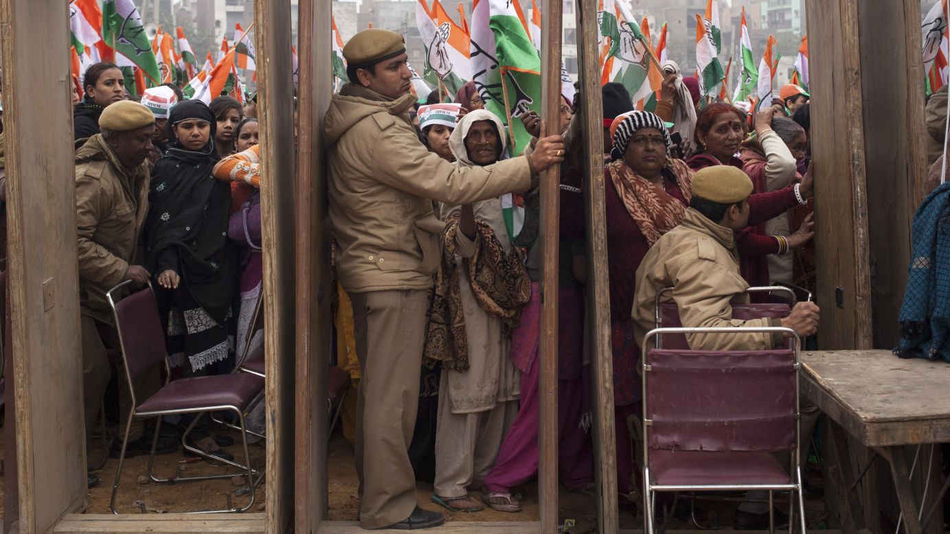Supporters of India's National Congress Party wait to enter a campaign rally in New Delhi on Wednesday, February 4.