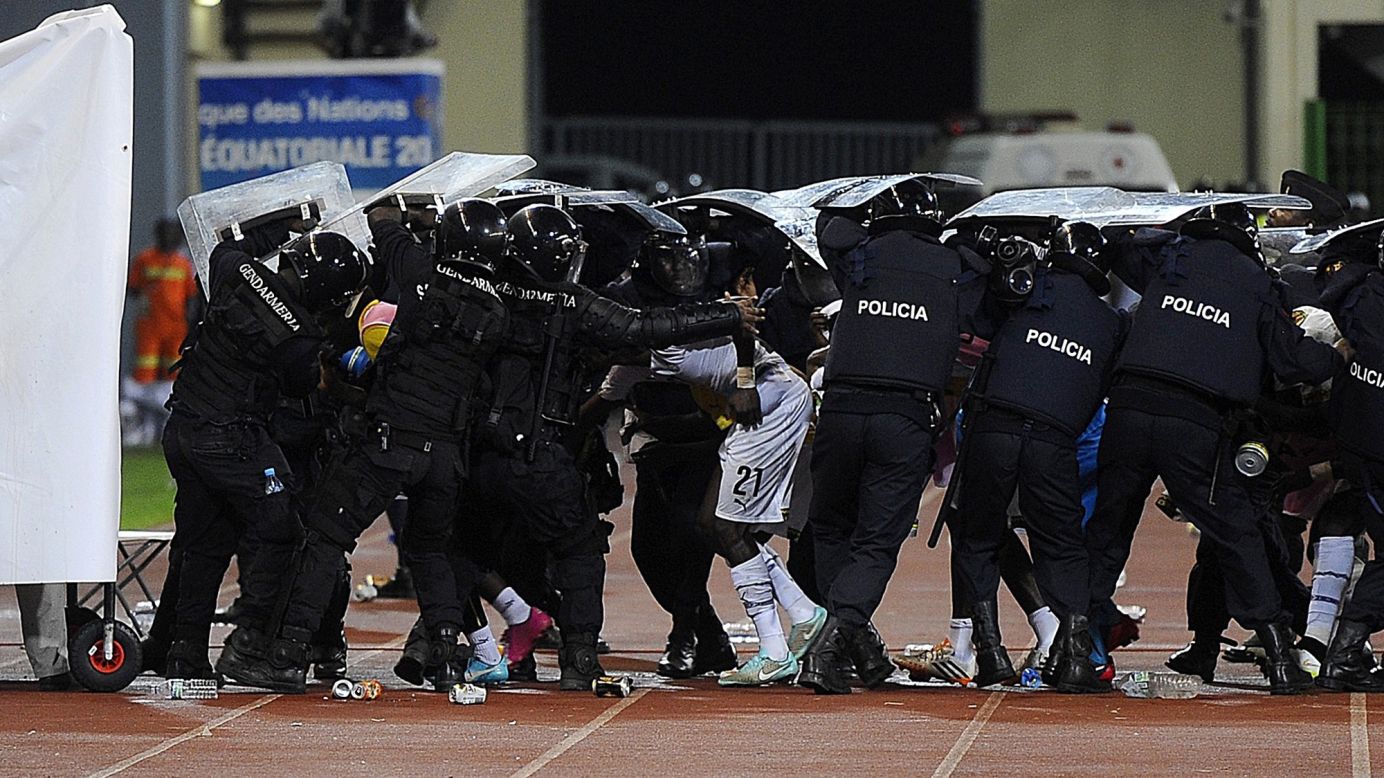 Police protect soccer players with their shields as fans throw materials at halftime of an African Cup of Nations match played Thursday, February 5, in Malabo, Equatorial Guinea. There was also <a href="http://edition.cnn.com/2015/02/05/football/afcon-semifinal-ghana-equatorial-guinea/index.html" target="_blank">crowd trouble</a> in the second half as Ghana defeated the home country 3-0 to advance to the tournament final.