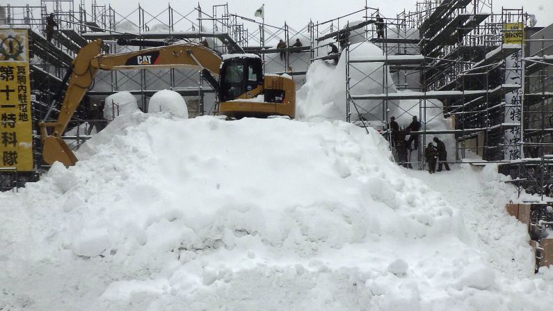"Snow Star Wars" required the most snow ever used on a sculpture at the Sapporo Snow Festival. Sculptors were making progress with Vader and the stormtroopers' heads peeking out on January 20.