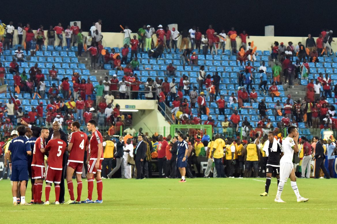 Both sets of players had to wait on the pitch as a decision was made whether to abandon the game or resume the action.