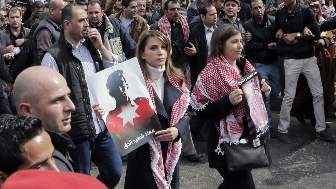Jordanian Queen Rania, center, holds a placard during a demonstration in Amman, Jordan, on Friday, February 6, after the death of pilot Moath al-Kasasbeh by ISIS. Al-Kasasbeh was burned alive in a video recently released by ISIS militants.