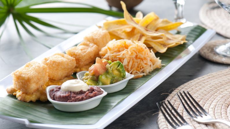 "Bunuelos de yuca y queso" are deep-fried fritters that contain yuca and salty white cheese. The popular dish (served here at the Jicaro Island Ecolodge) is usually served with guacamole and mashed beans. 
