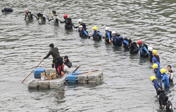 Divers continue search operations at the crash site in Taipei on Friday, February 6.