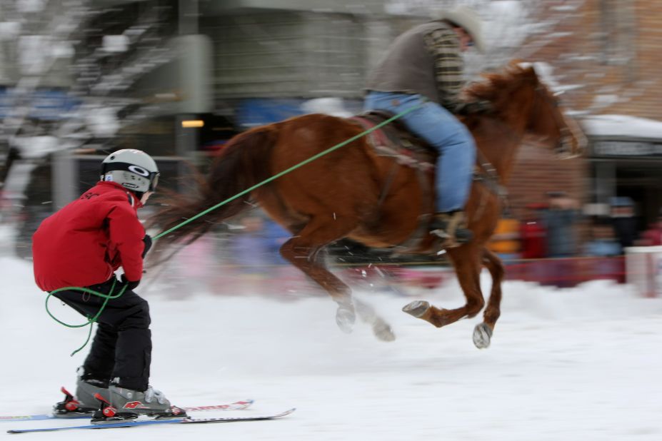 In the United States, the sport is different with riders on board the horses and skiers pulled along by a single rope.
