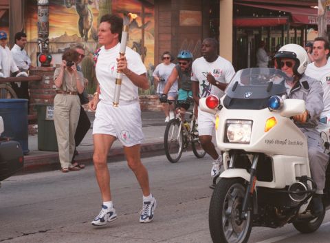Jenner carries the Olympic flame down Sunset Boulevard in West Hollywood, California, on April 27, 1996.
