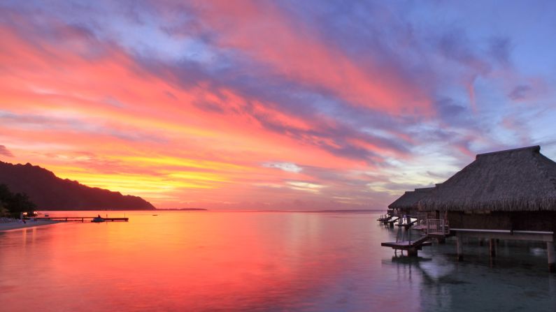 Often touted as the world's most beautiful island, (almost) heart-shaped <a  target="_blank" target="_blank">Moorea</a> is half an hour by high-speed ferry from Tahiti. Beach resorts with posh over-water bungalows wrap around white sand beaches and two fjord-like bays on the north shore. <br /><strong>Romantic rush:</strong> Swimming with rays, sharks and dolphins.<br /><strong>Hot hotel:</strong> <a  target="_blank" target="_blank">Hilton Moorea Lagoon Resort and Spa</a>, Papetoai, French Polynesia; +689 44 55 1111