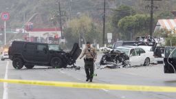 A Los Angeles County Sheriff's department investigates the scene of a collision involving three vehicles in Malibu, Calif. on Saturday, Feb. 7, 2015. Officials said former Olympian Bruce Jenner was a passenger in one of the cars involved in the Pacific Coast Highway crash that killed one person. Jenner's publicist, Alan Nierob, says Jenner was unhurt. (AP Photo/Ringo H.W. Chiu)