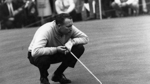 Billy Casper, who won the 1966 U.S. Open, lines up a putt.